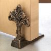 Accent Plus Cast Iron Antique-Look Fleur de Lis Door Stopper